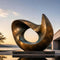 Minimalist abstract sculpture displayed in a contemporary outdoor architectural space