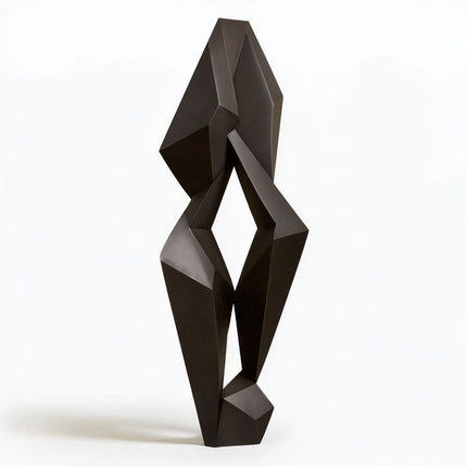 Abstract bronze sculpture with angular faceted forms and a central geometric opening