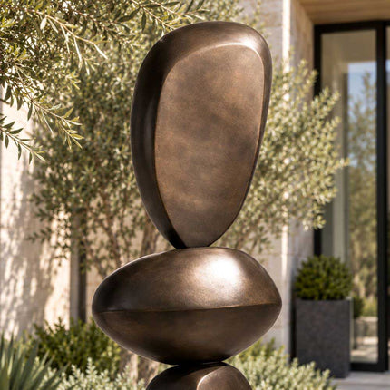 Close-up of the upper rounded forms of an abstract bronze sculpture