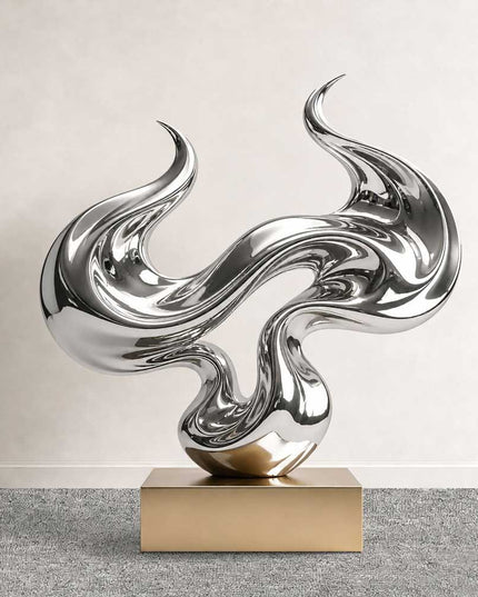 Abstract flow sculpture in mirror polished stainless steel with fluid reflective curves