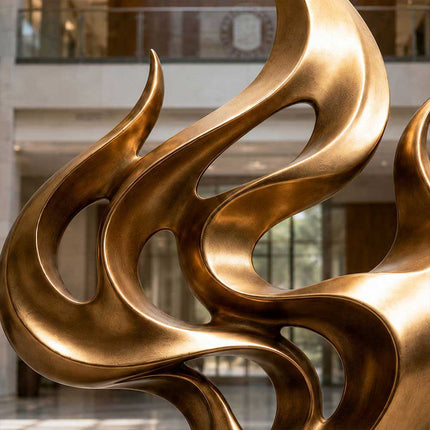 Bronze abstract sculpture detail with flowing organic curves and open form
