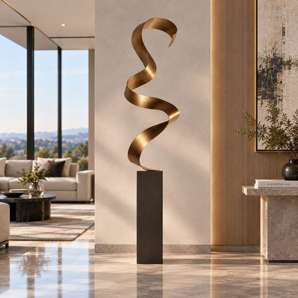 Abstract stainless steel ribbon sculpture displayed in a contemporary interior