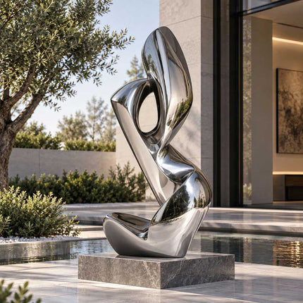 Mirror polished abstract stainless steel sculpture in a modern outdoor courtyard