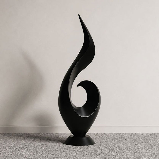 Ascending flame abstract sculpture in matte black stainless steel with a flowing vertical form