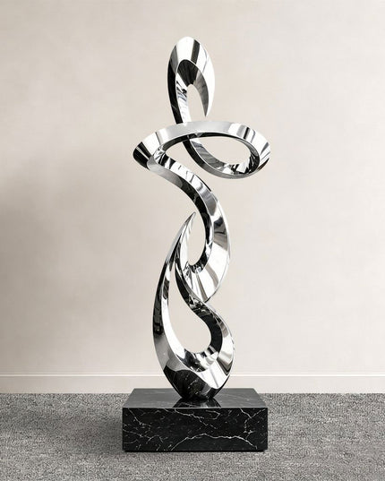 Ascending ribbon abstract sculpture in mirror polished stainless steel with stone base