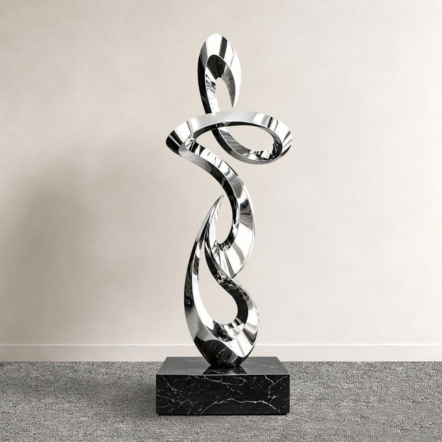 Ascending ribbon abstract sculpture in mirror polished stainless steel with stone base