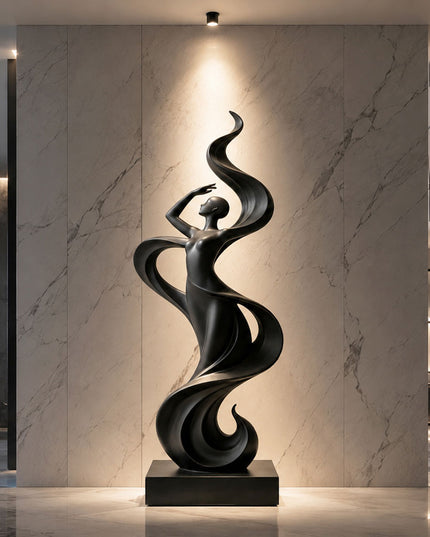 Black stainless steel female figure sculpture displayed in a luxury marble interior