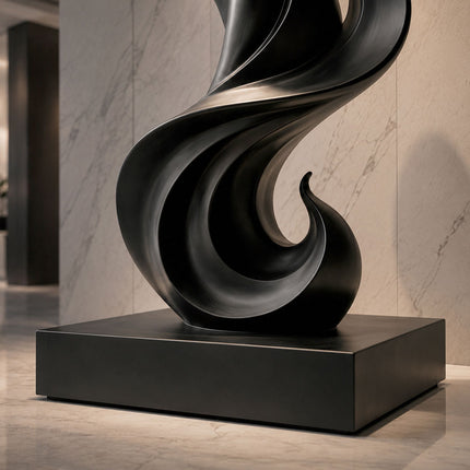 Detail view of black painted stainless steel sculpture base and curved metal structure