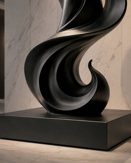 Detail view of black painted stainless steel sculpture base and curved metal structure