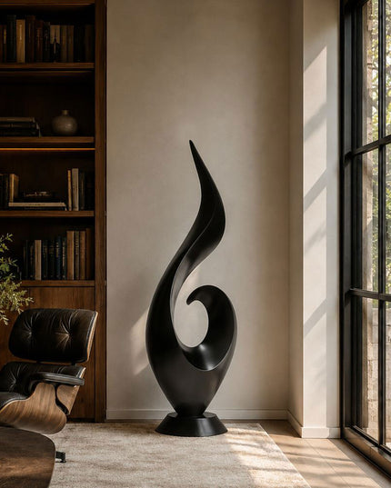 Black stainless steel abstract sculpture placed in a contemporary luxury interior