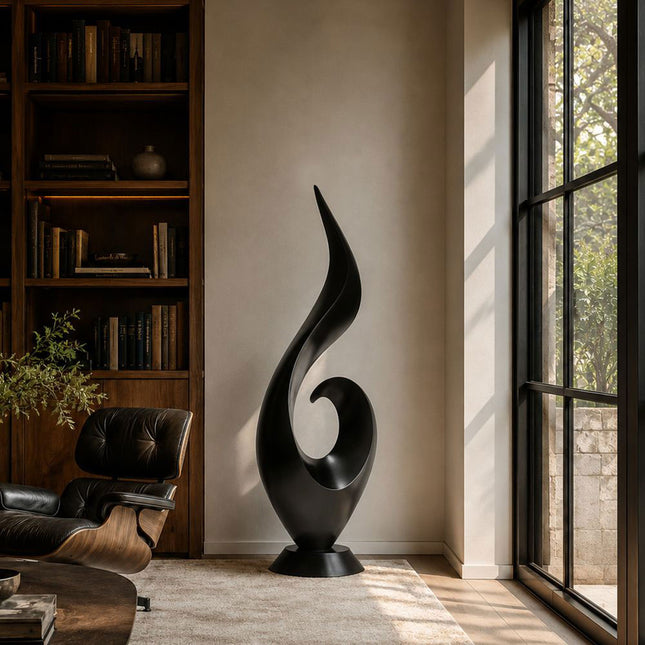 Black stainless steel abstract sculpture placed in a contemporary luxury interior