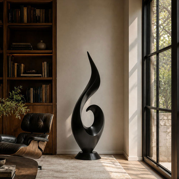 Black stainless steel abstract sculpture placed in a contemporary luxury interior