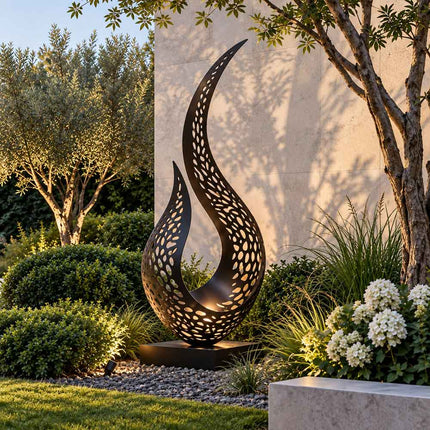 Black perforated stainless steel sculpture displayed in a landscaped modern garden