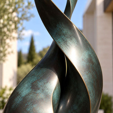Close-up of blue-green patina and warm bronze highlights on overlapping curved sculpture surfaces
