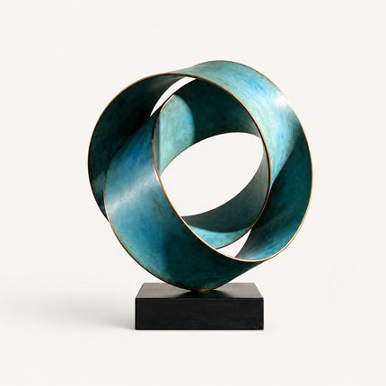 Bronze abstract sculpture with interlocking ribbon loops, blue-green patina, and black rectangular base