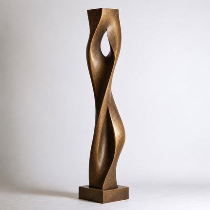 Bronze art sculpture with twisting vertical forms and a central teardrop-shaped opening