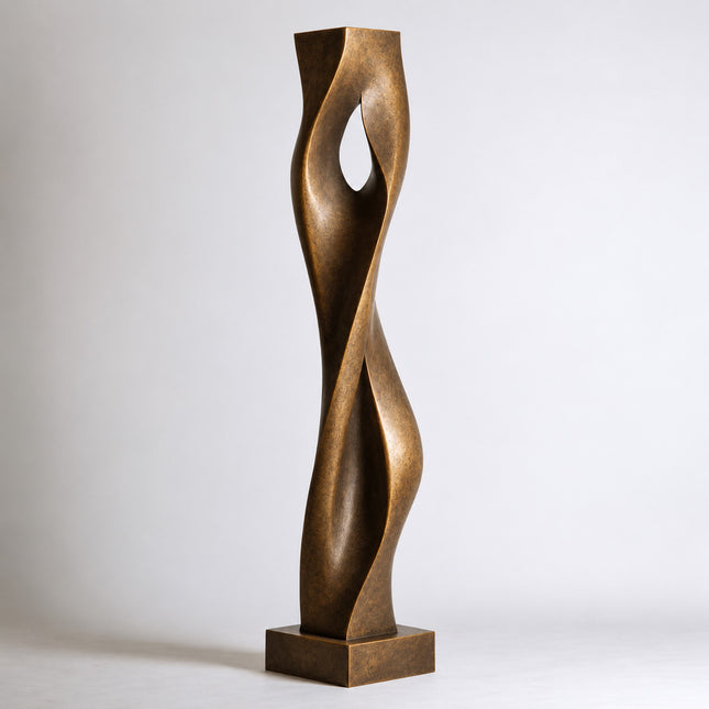 Bronze art sculpture with twisting vertical forms and a central teardrop-shaped opening