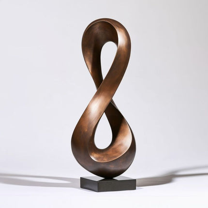 Bronze abstract sculpture with a continuous loop and two open spaces