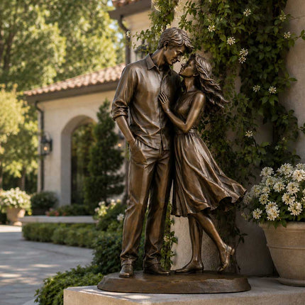 Bronze couple sculpture displayed in a luxury garden environment