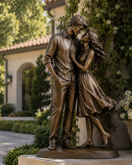 Bronze couple sculpture displayed in a luxury garden environment