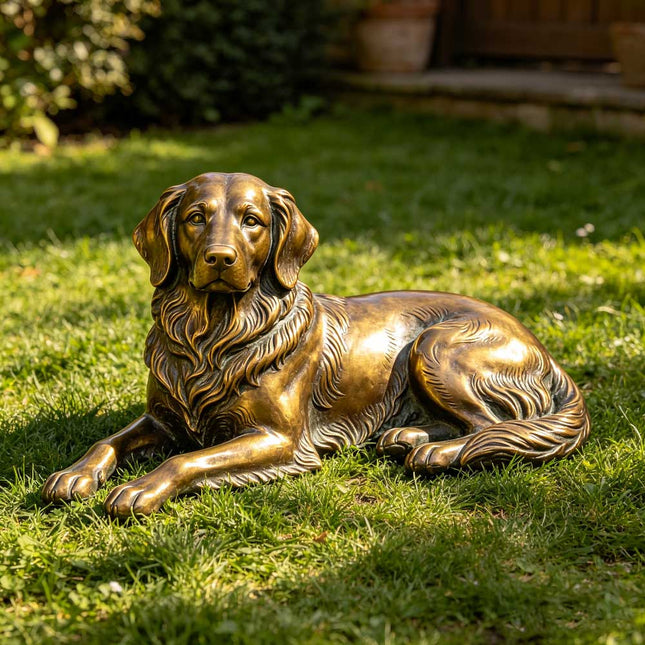 Bronze dog sculpture displayed in a residential garden landscape