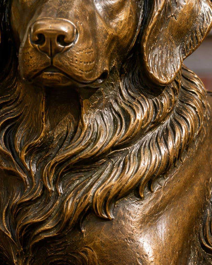 Close-up detail of handcrafted bronze dog sculpture head and fur texture
