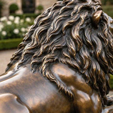Bronze lion sculpture detail showing layered mane texture and warm highlights