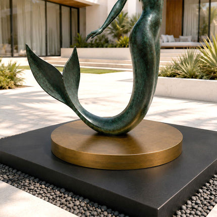 Bronze mermaid sculpture tail detail showing textured patina finish