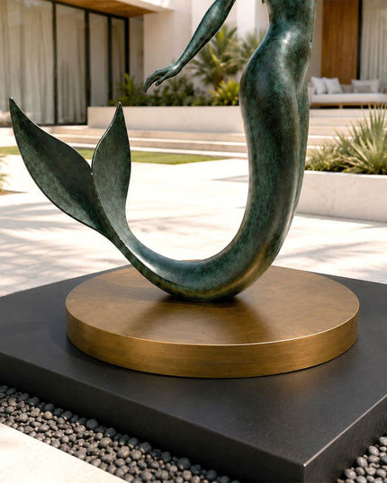 Bronze mermaid sculpture tail detail showing textured patina finish