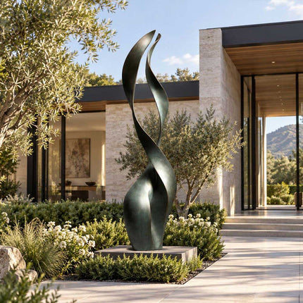 Tall bronze ribbon sculpture with green patina displayed in a modern private garden