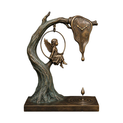 Bronze sculpture with a winged figure on a circular swing and melting clock