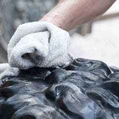 Final hand finishing of a handcrafted bronze sculpture before delivery