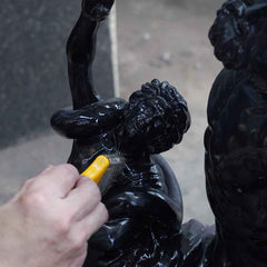 Applying a protective finish to enhance and preserve a handcrafted bronze sculpture