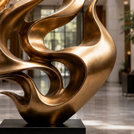 Bronze sculpture detail showing curved surfaces and golden brown patina