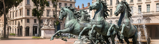 Large bronze sculptures in a public plaza showcasing timeless craftsmanship and artistic design