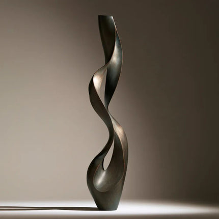 Abstract bronze sculpture with a tall twisting ribbon form and narrow openings