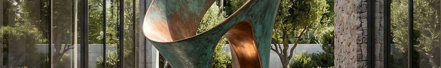 Contemporary abstract bronze sculpture installed in a modern architectural courtyard