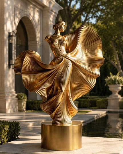Contemporary gold stainless steel sculpture installed in a formal architectural garden setting