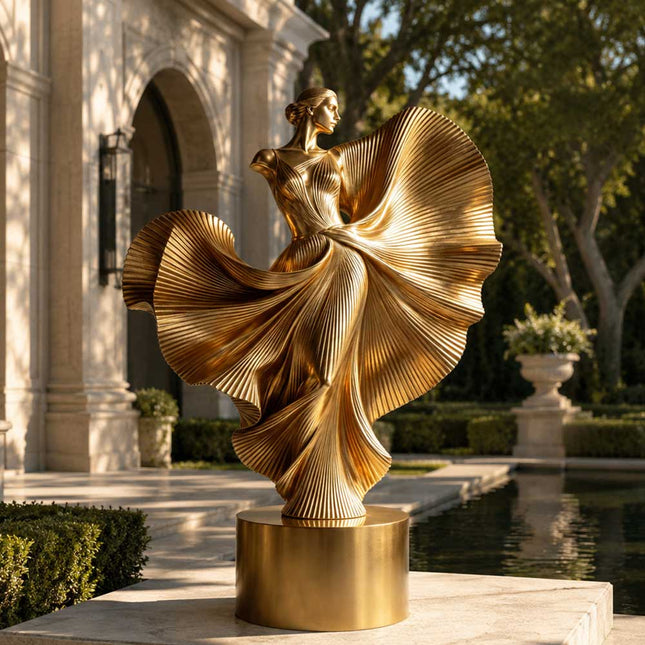 Contemporary gold stainless steel sculpture installed in a formal architectural garden setting