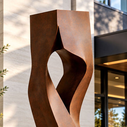 Close-up of the open center and folded planes of a Corten steel sculpture
