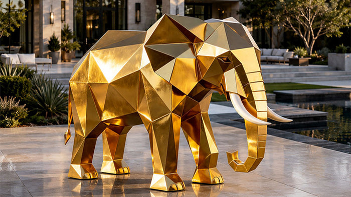 Large custom golden elephant sculpture installed in a luxury outdoor space showcasing monumental sculpture design and craftsmanship