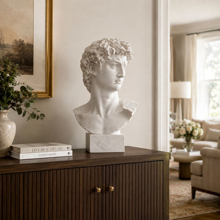 Marble David bust sculpture displayed in an elegant interior space