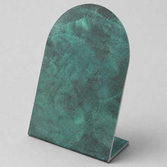 Deep verdigris bronze finish with layered green patina and rich tonal variation.