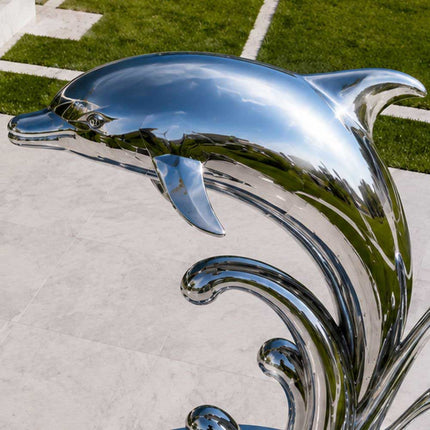 Detailed view of handcrafted stainless steel dolphin sculpture head and form