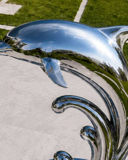 Detailed view of handcrafted stainless steel dolphin sculpture head and form
