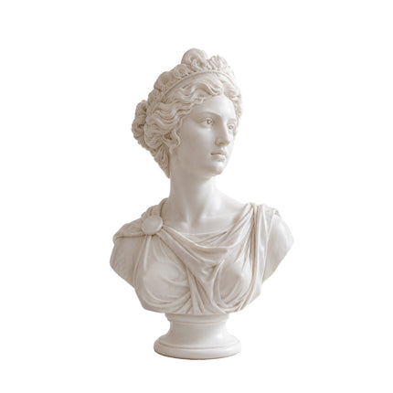 Front view of a classical female marble bust with detailed hair and draped clothing