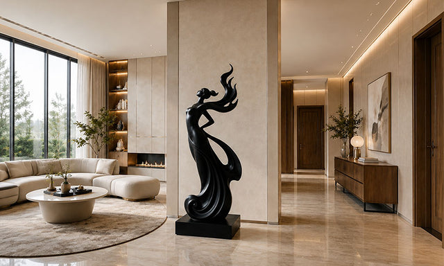 Modern figure sculpture with a black finish displayed in a luxury contemporary interior