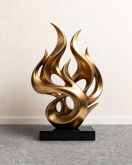 Flowing flame abstract sculpture in gold stainless steel with curved organic forms