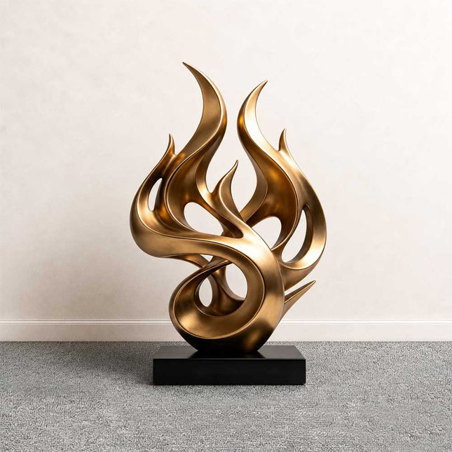 Flowing flame abstract sculpture in gold stainless steel with curved organic forms