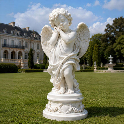 White marble angel statue displayed on a formal estate lawn